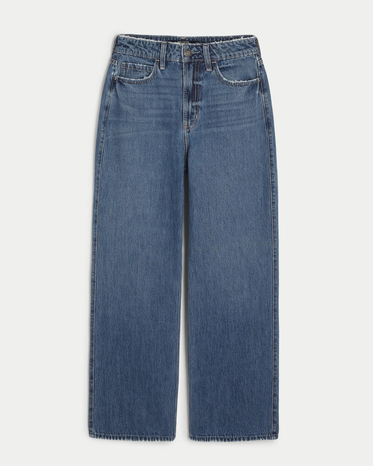 Jeans holgados con lavado medio y tiro superalto