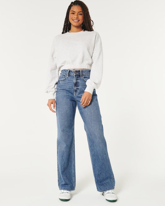 Jeans holgados con lavado medio y tiro superalto